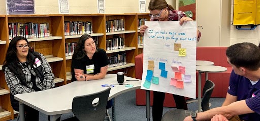 Families from West Campus giving input to the Design Team around a table